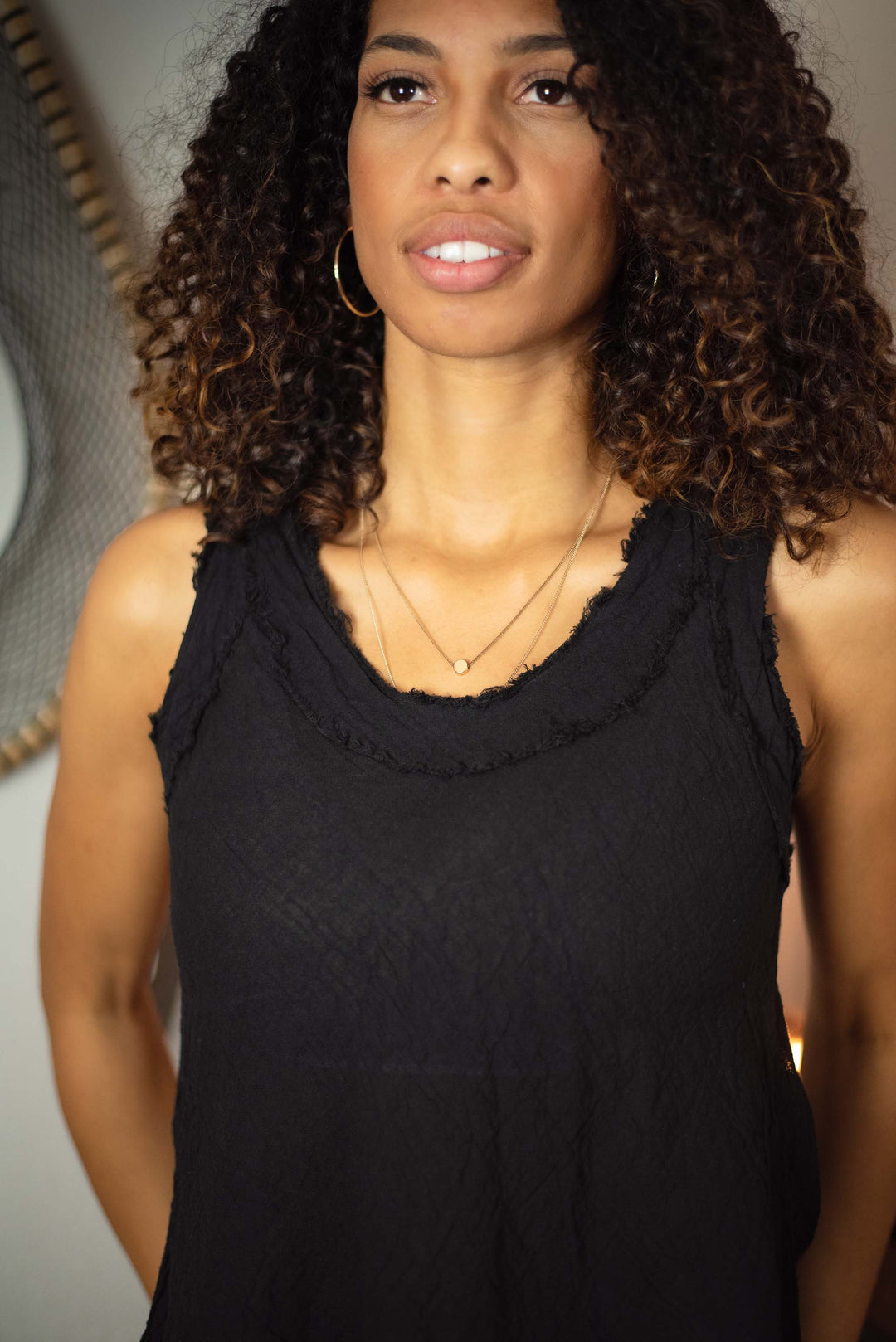 Model wears black tank top gauze clothing
