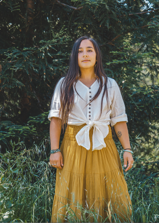 Model shows off her un-dyed button blouse and yellow maxi skirt.