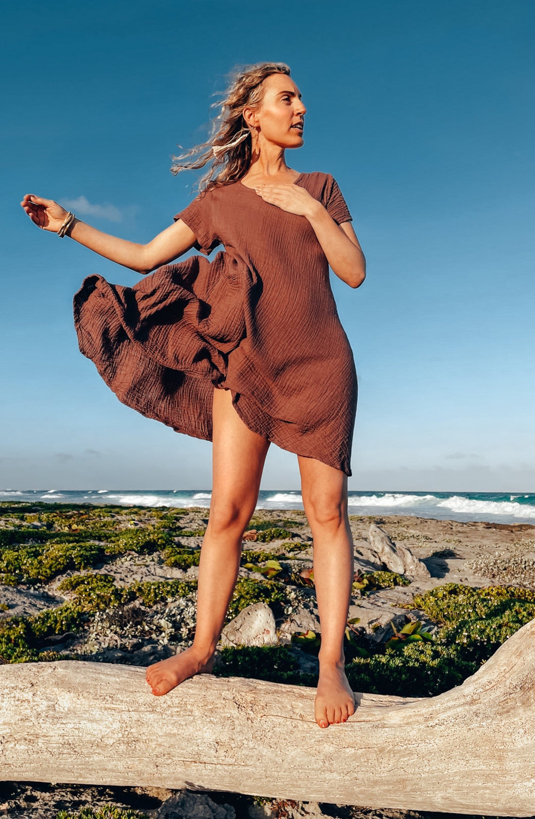 Female wears gauze cotton mini dress