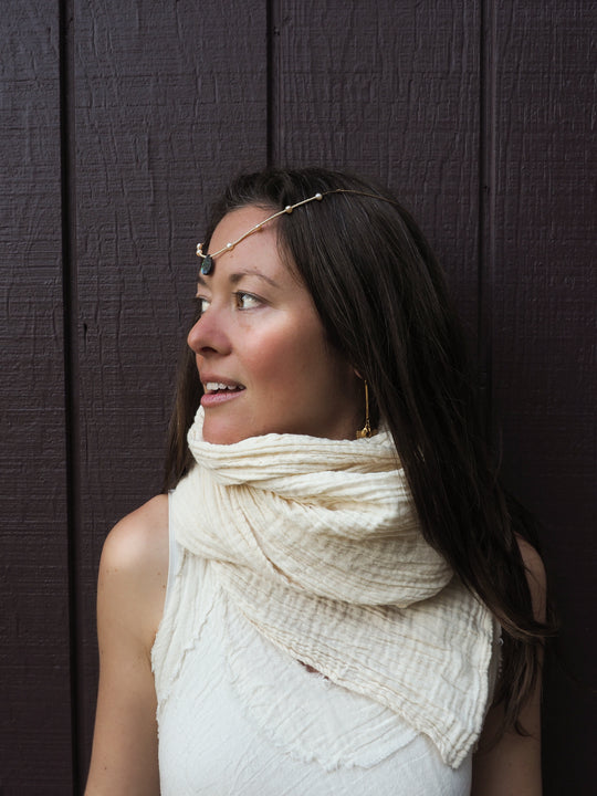 Model wears un-dyed gauze wrap around neck.