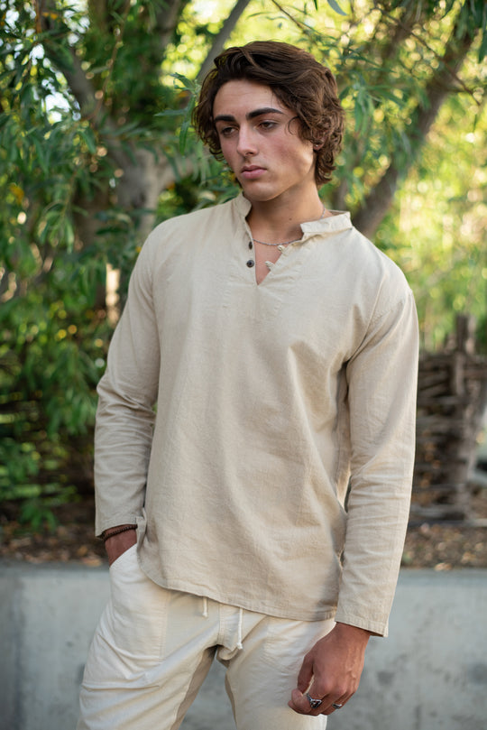 Model is clothed in un-dyed dress shirt and pants.