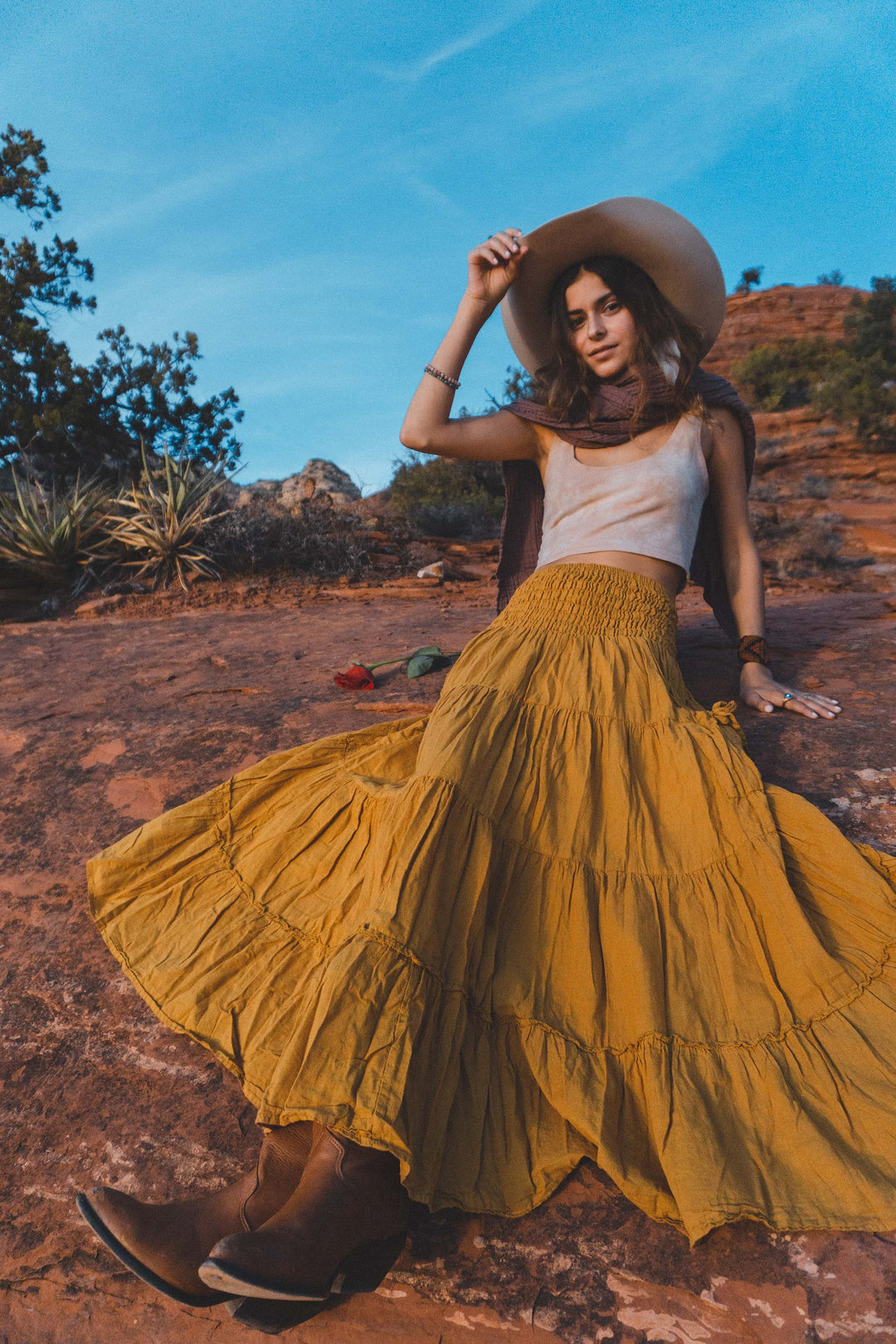 Model wears tank top and long tiered pocket skirt of gauze cotton