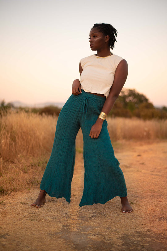Woman in field wearing long gauze cotton pants