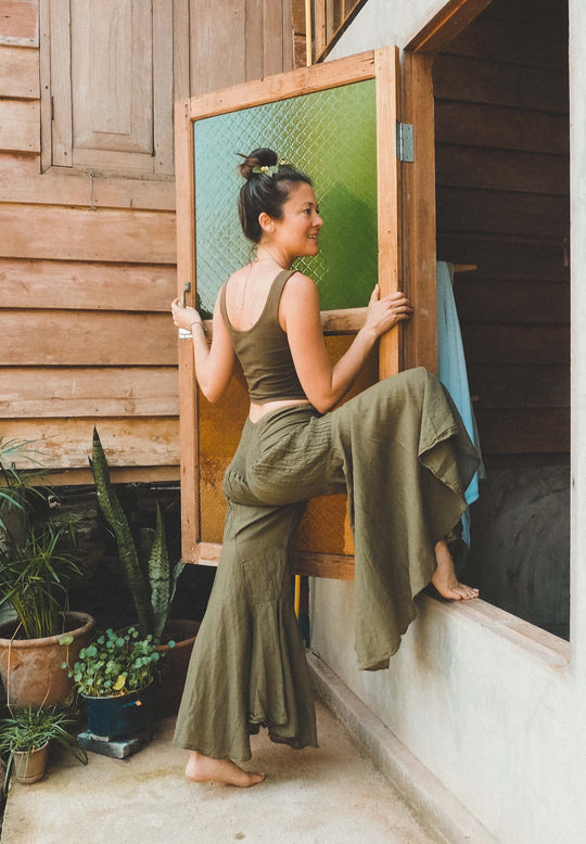 Woman poses in gauze bell pants