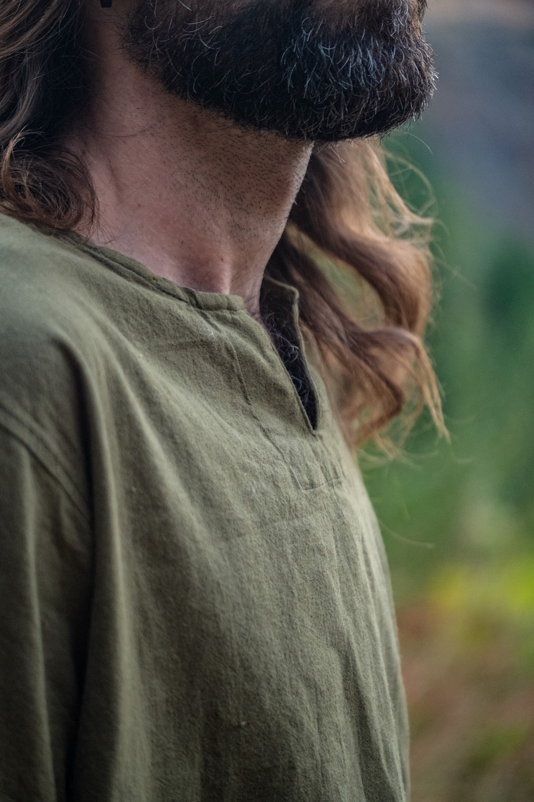 Men's olive green cotton shirt with v-neck.